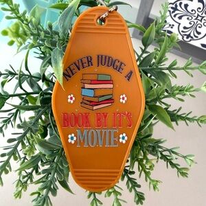 Hand Crafted vintage-style motel key Never Judge a Book by Its Movie keychain